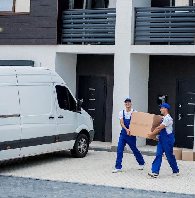 two-removal-company-workers-are-loading-boxes-furniture-into-minibus-min